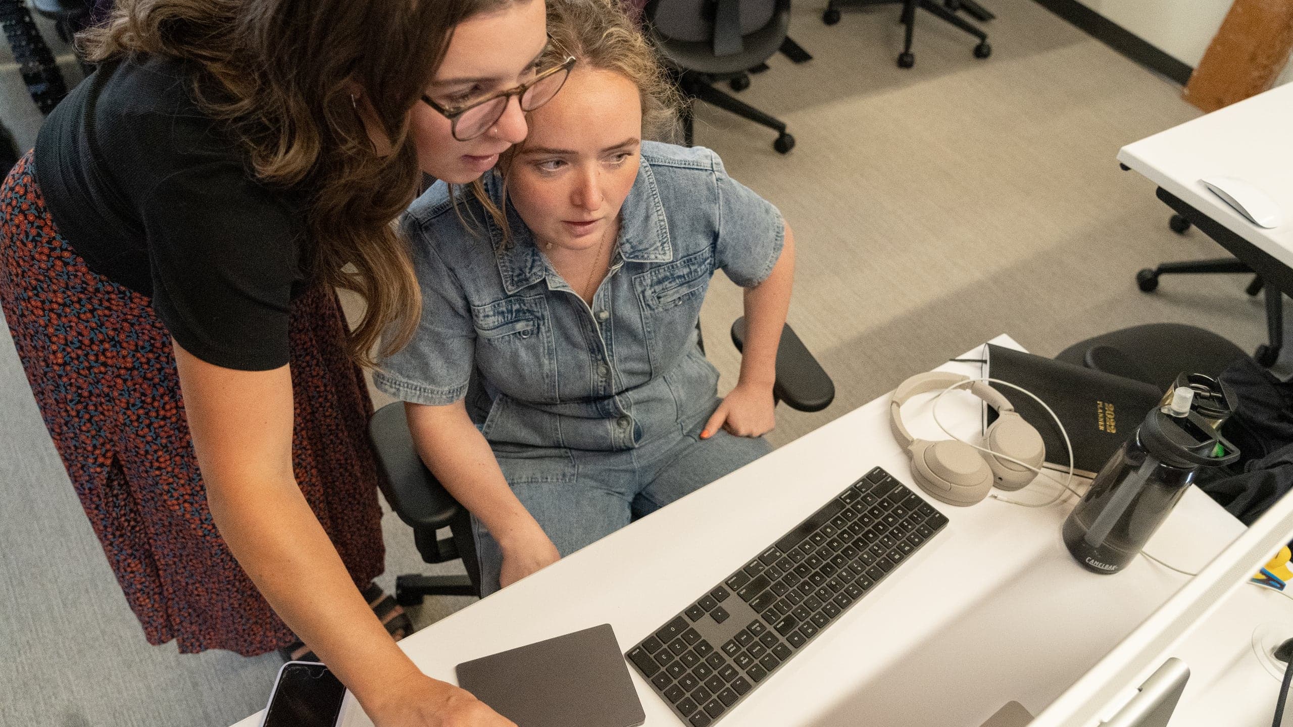 Collaborating at computer desk