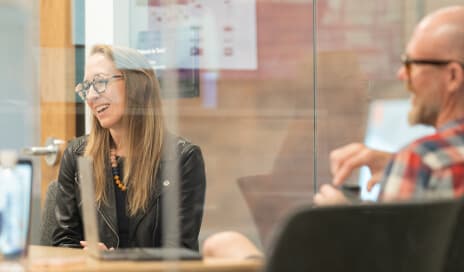 Woman collaborating with colleagues in a conference room