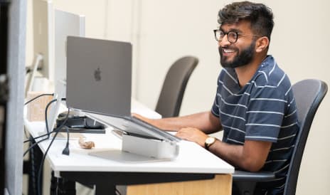 Developer working on a monitor at his desk