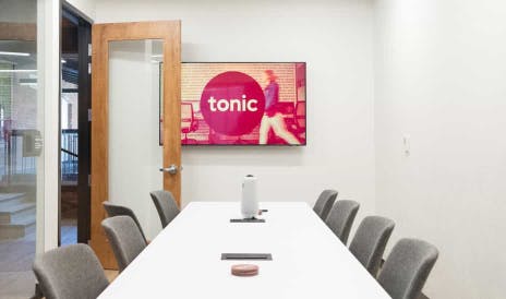 Conference room with logo on display