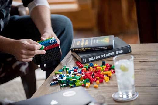 Building lego blocks on a table.