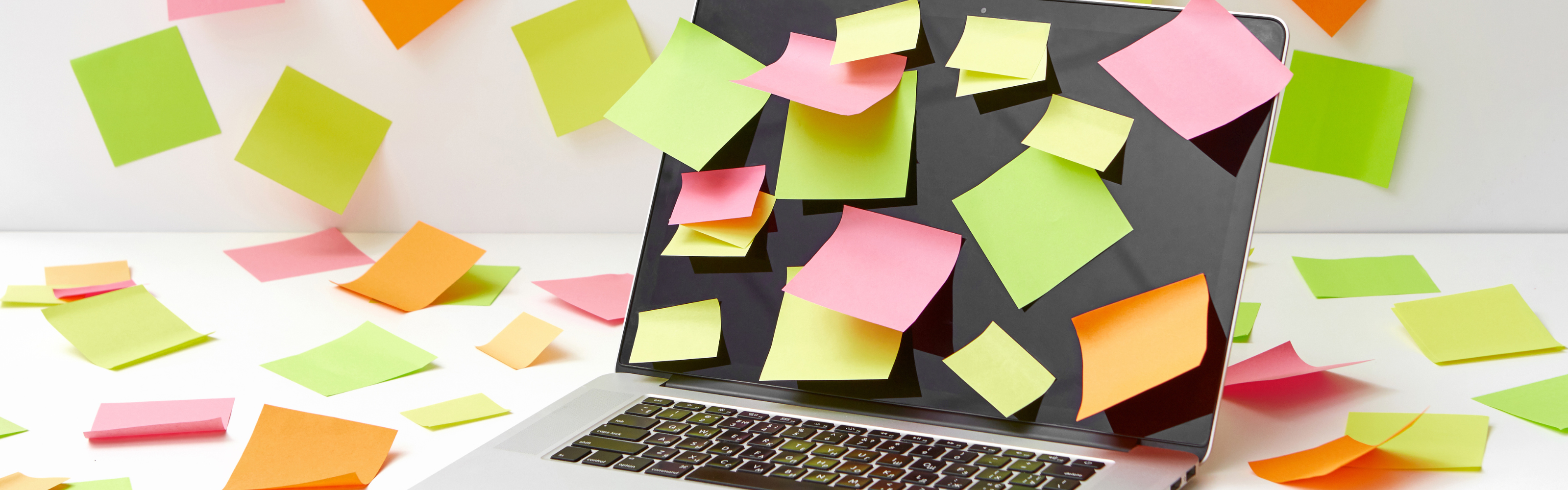 Laptop covered with Post-it Notes